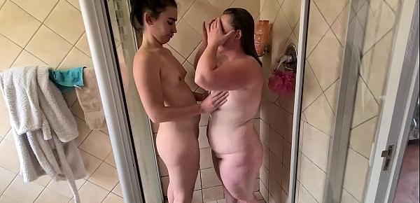  Two lesbian girls washing each other in the shower